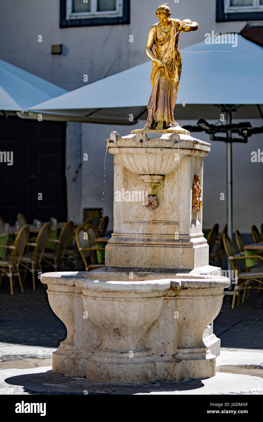 A water fountain with a statue of a woman at the top Stock Photo - Alamy