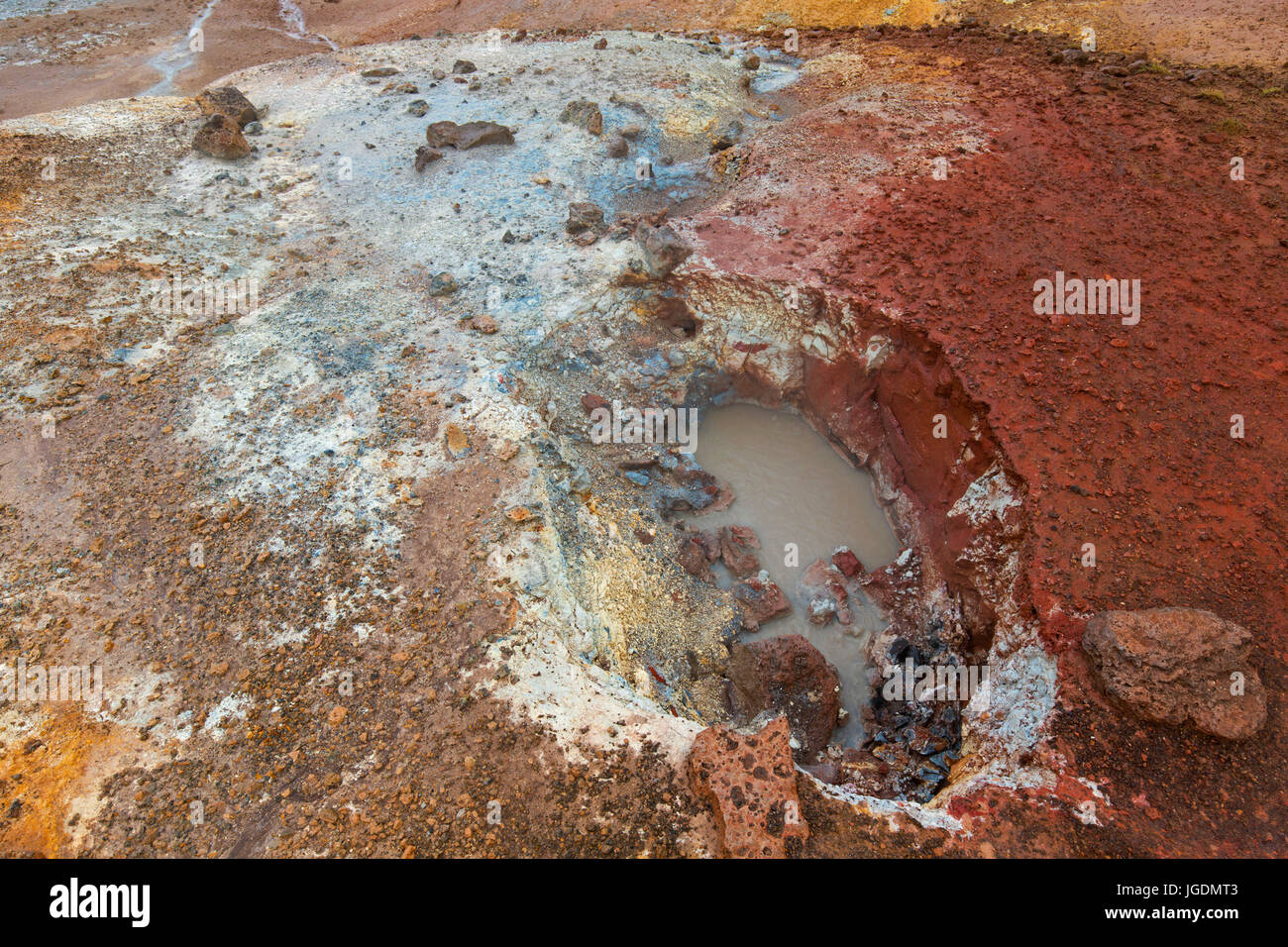 Bubbling mud in mudpot / mud pool at Seltun, geothermal field showing volcanic fumaroles, mud pots and hot springs, Reykjanes Peninsula, Iceland Stock Photo