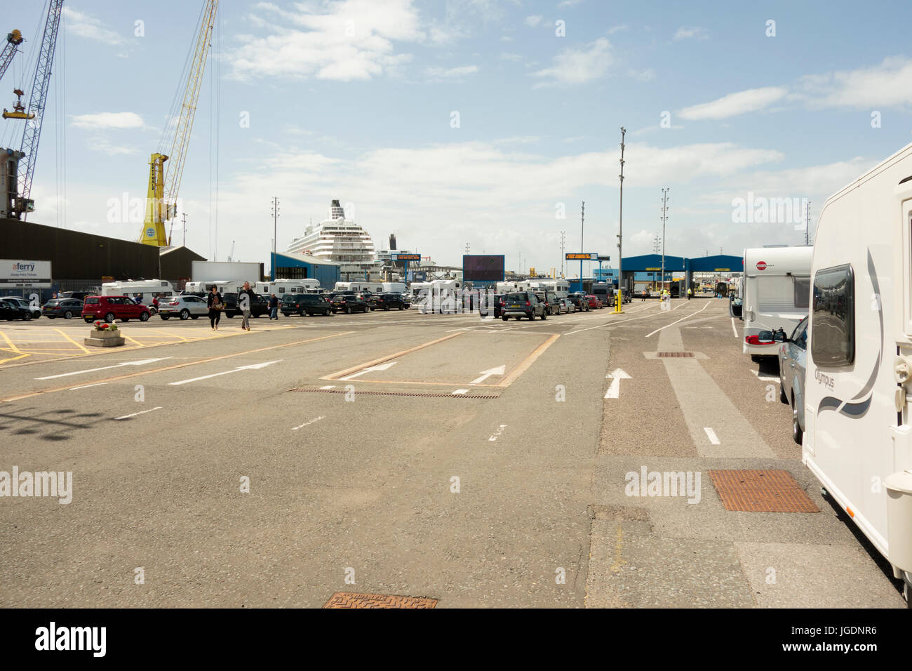 Cars and caravans lined up waiting to board a Brittany Ferries boat in Portsmouth Stock Photo