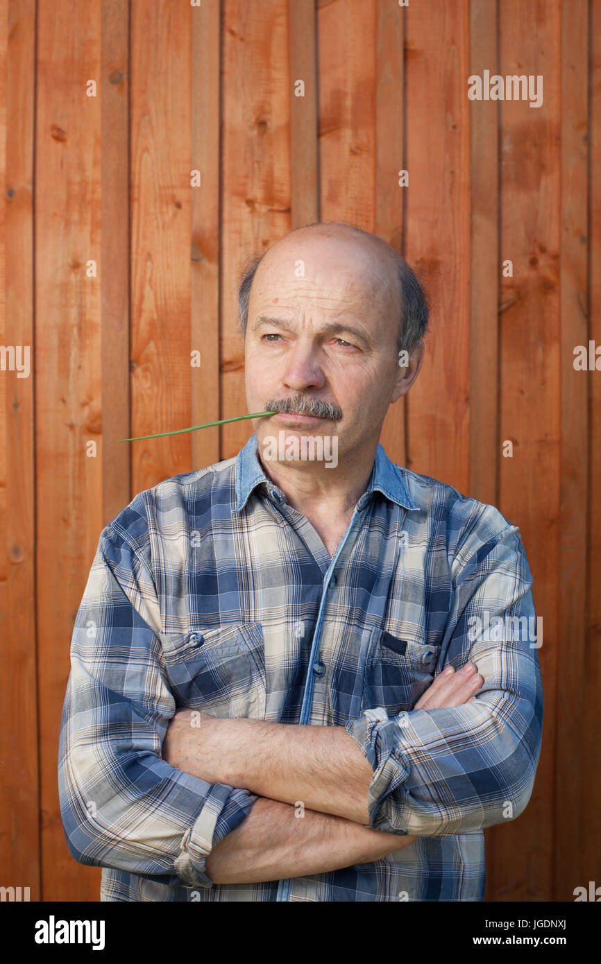 portrait of thoughtful middle aged man outdoors Stock Photo