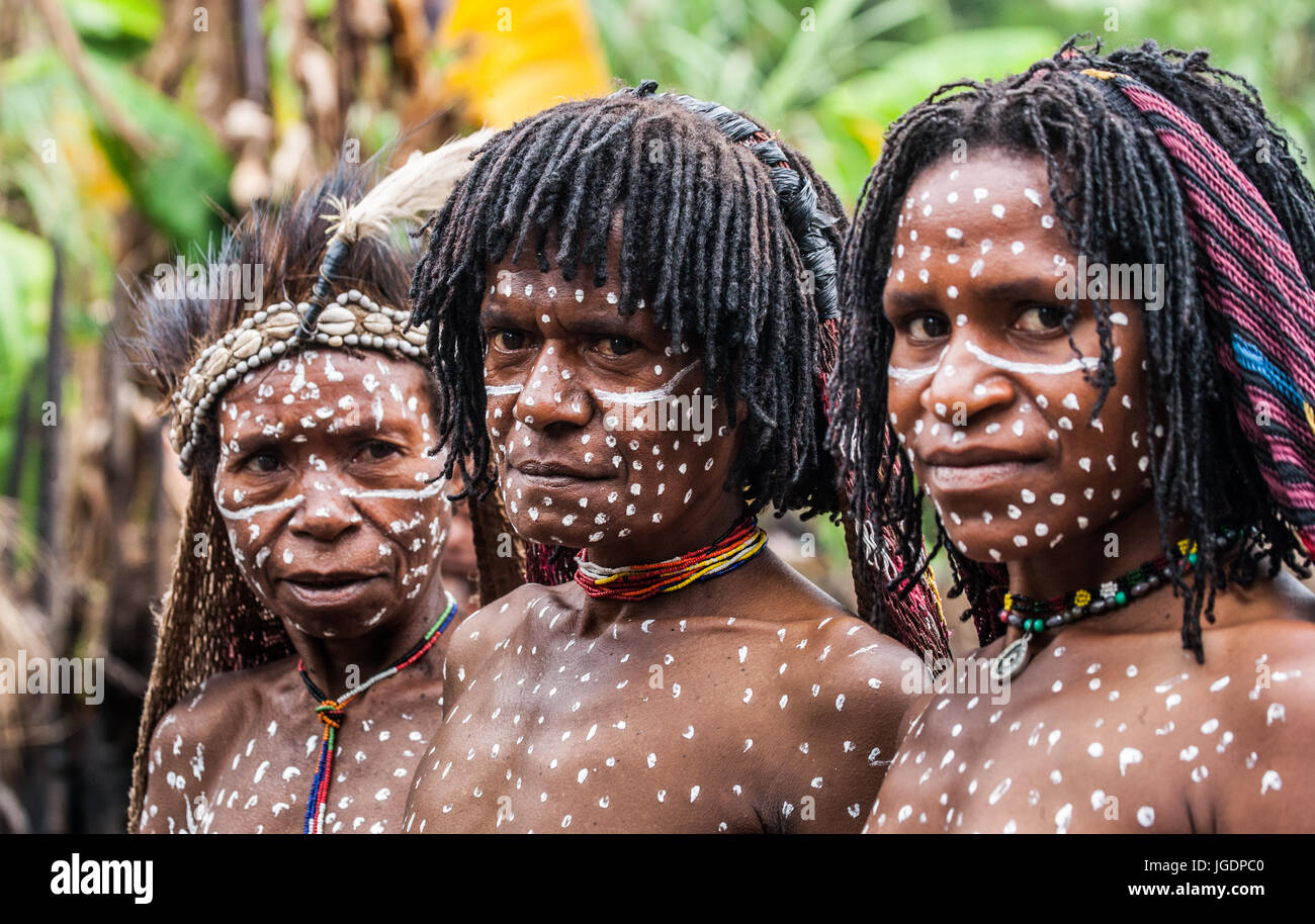The undated picture shows a group of young Papua women with white body paint  in Papua New Guinea. The population of Papua New Guinea, consisting mainly  of Papuas, is very diverse. The