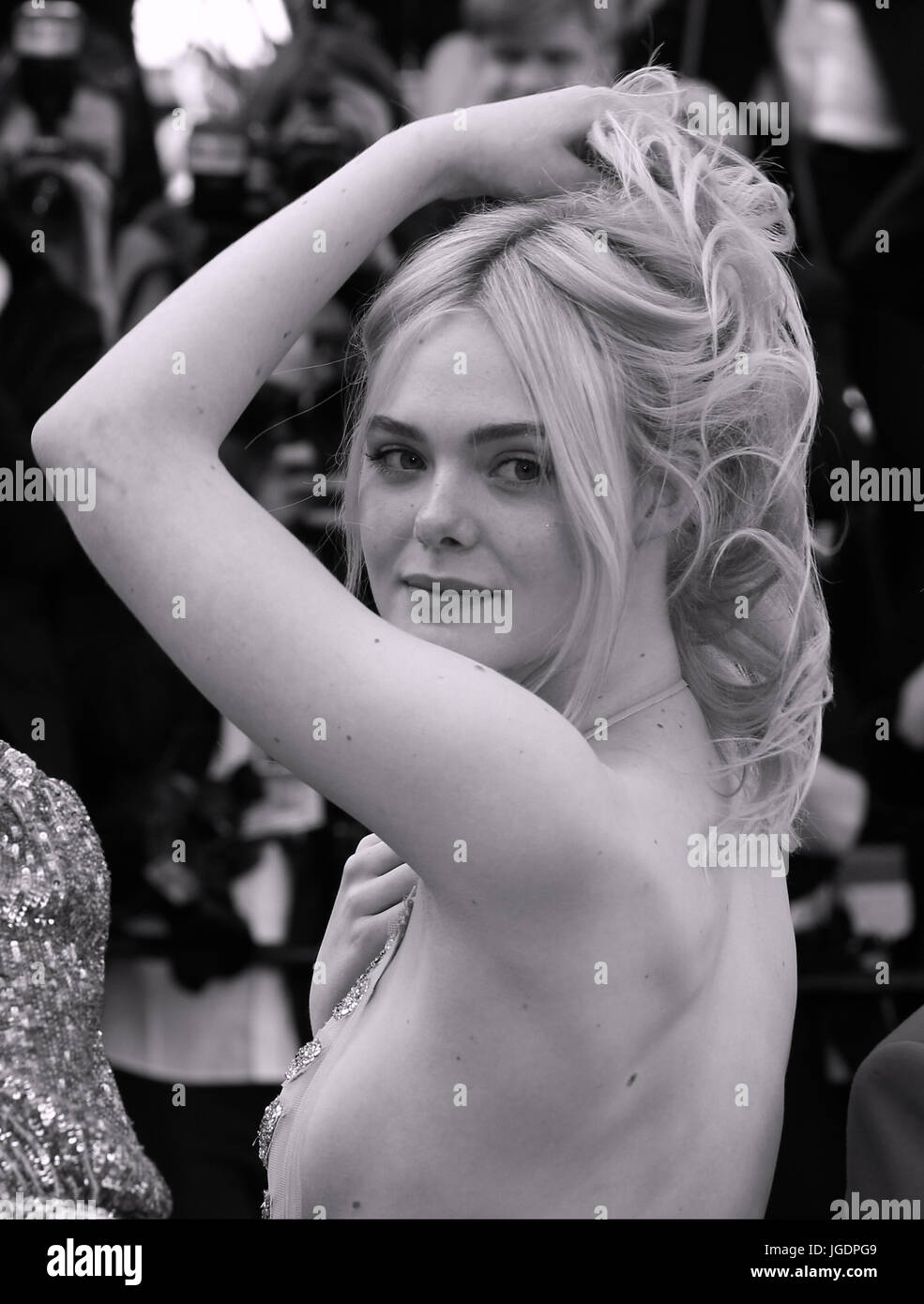 Elle Fanning depart after the How To Talk To Girls At Parties screening during the 70th annual Cannes Film Festival at Palais des Festivals on May 21, 2017 in Cannes, France. Stock Photo