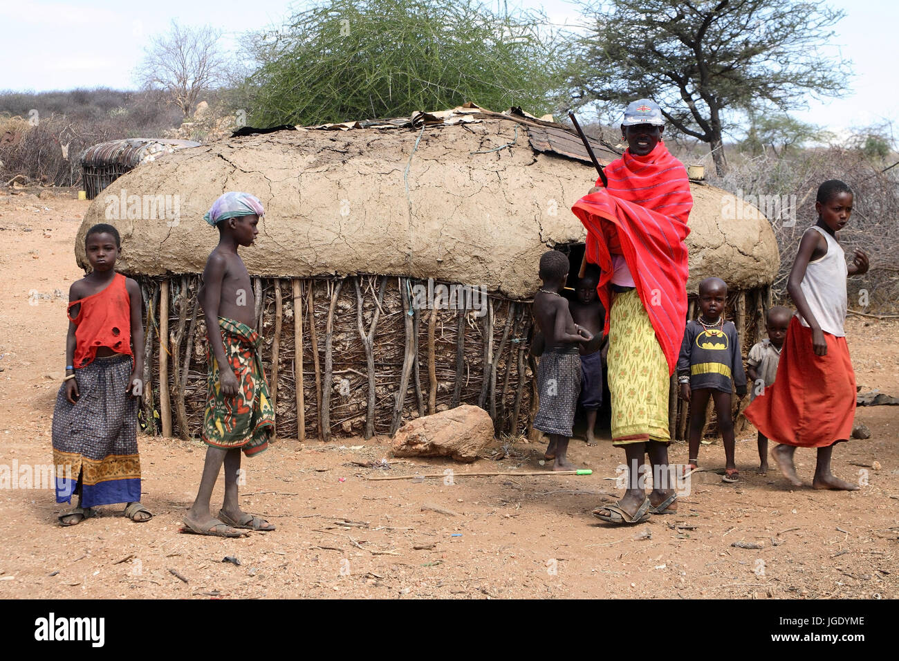 Samburus before her typical hut in Nordkenia, Samburus vor ihrer typischen Huette in Nordkenia Stock Photo