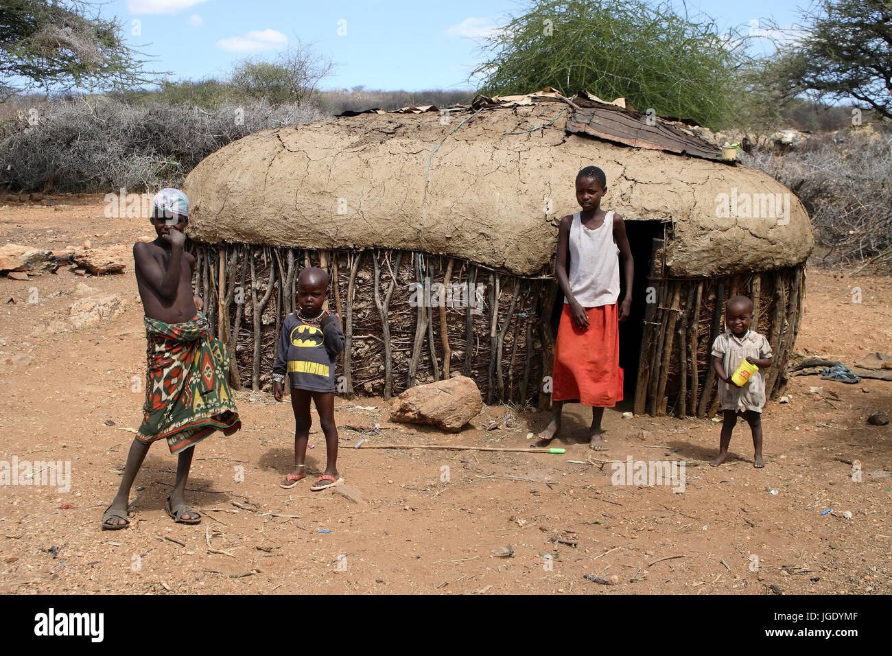 Samburus before her typical hut in Nordkenia, Samburus vor ihrer typischen Huette in Nordkenia Stock Photo