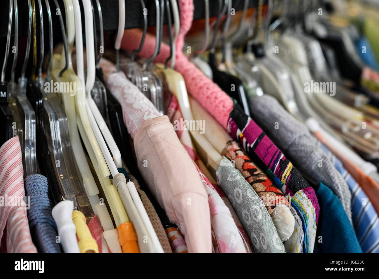 Rack of woman's dresses displayed at a thrift shop. Stock Photo