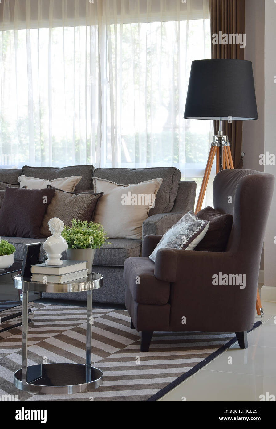 modern living room design with sofa and wooden lamp Stock Photo - Alamy