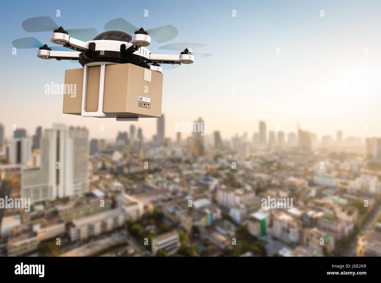 3d rendering delivery drone flying with cardboard box Stock Photo - Alamy