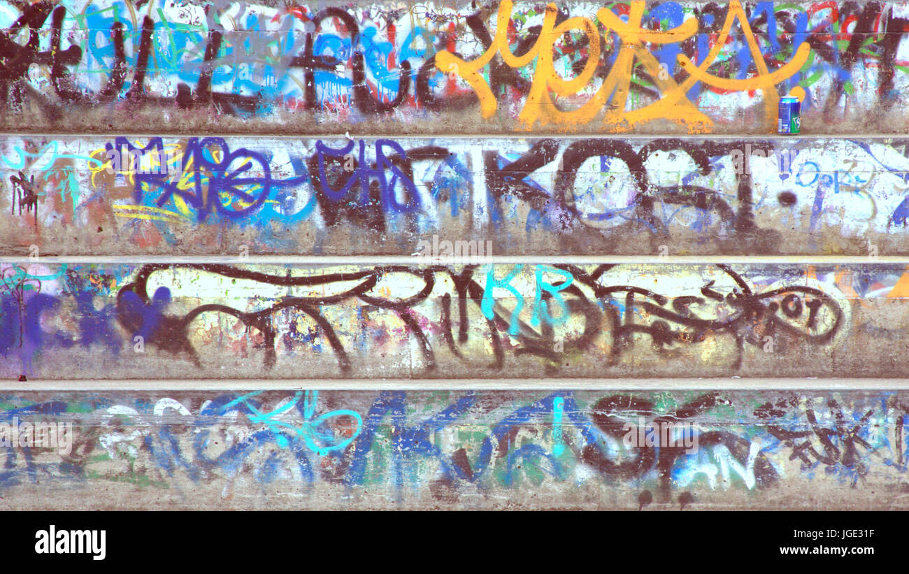 grunge colorful graffiti vandalism concrete steps Stock Photo