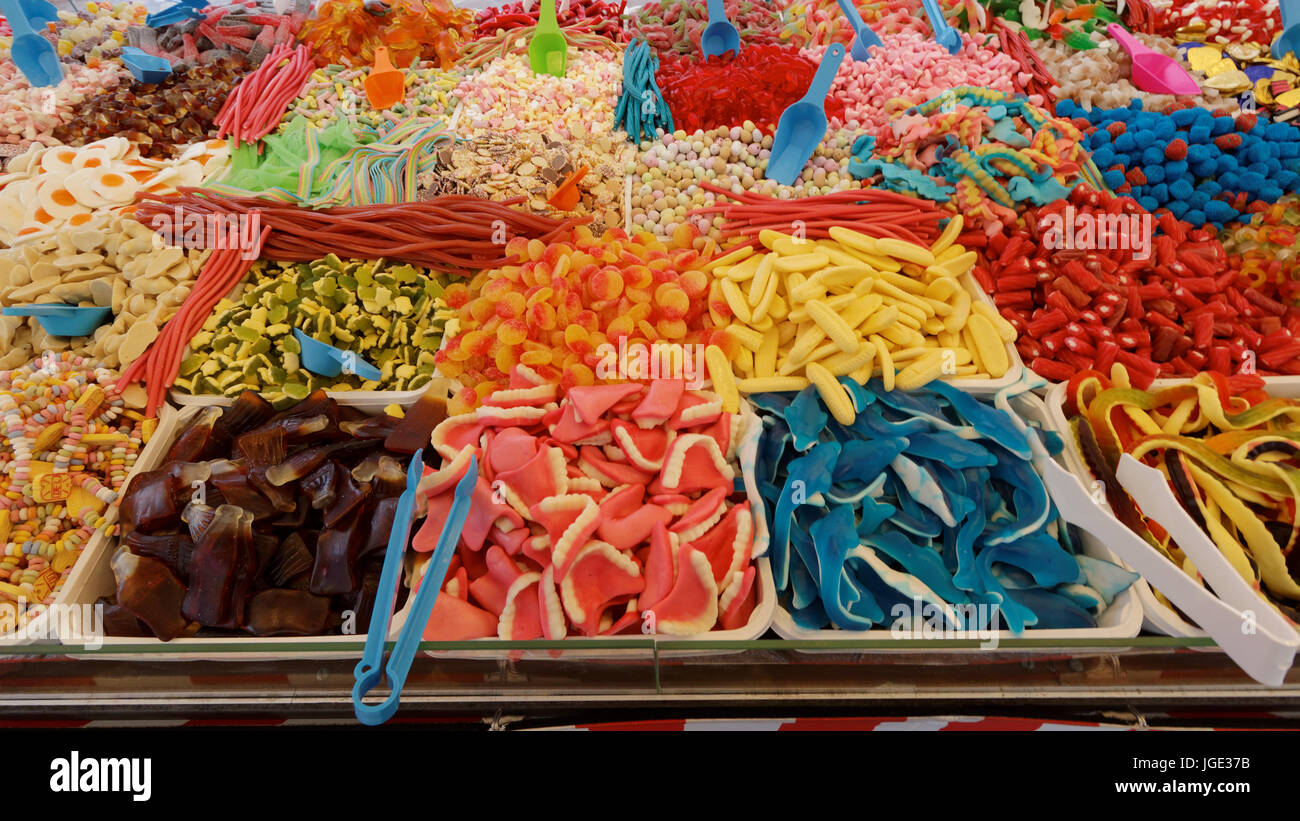 colorful selection of sweets or candy colourful market stall choice of children pick and mix foreign  sweetmeats pik n mix Glasgow Christmas market Stock Photo