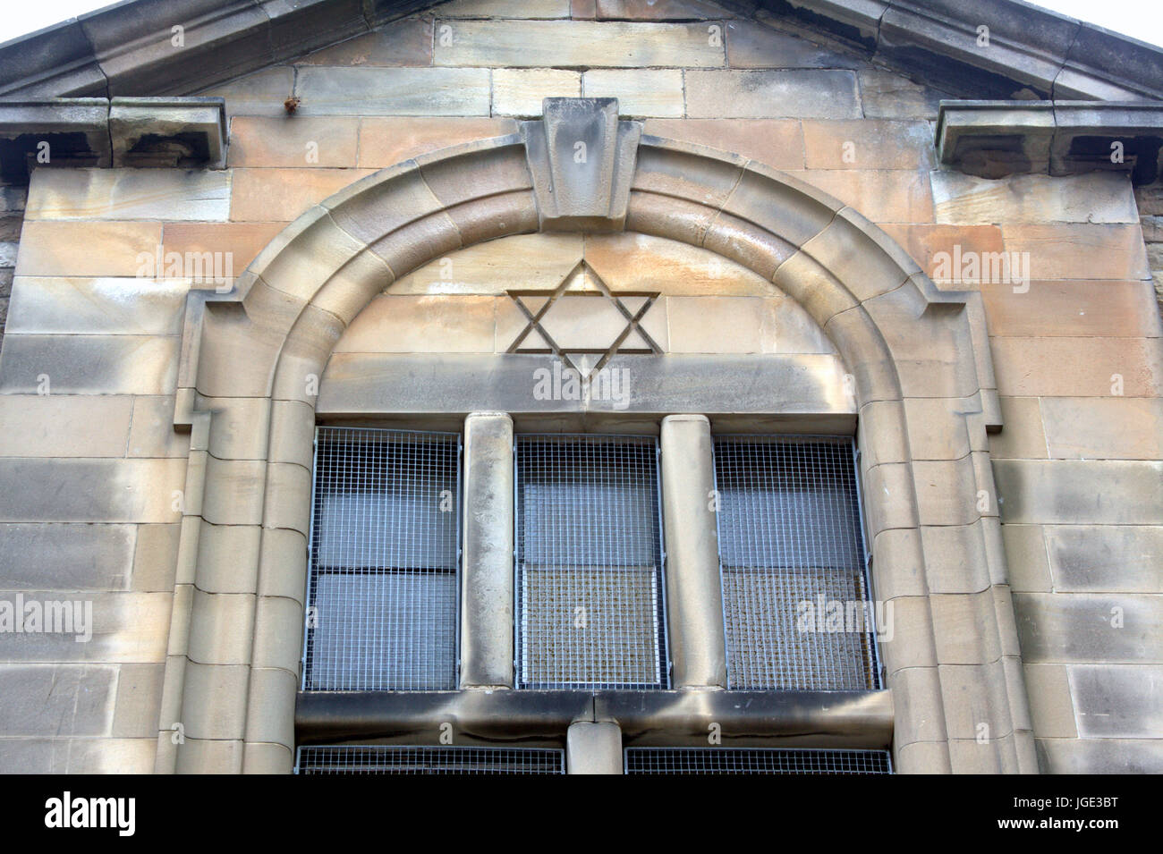 Jewish star of David carved sculpted into sandstone front of synagogue Stock Photo