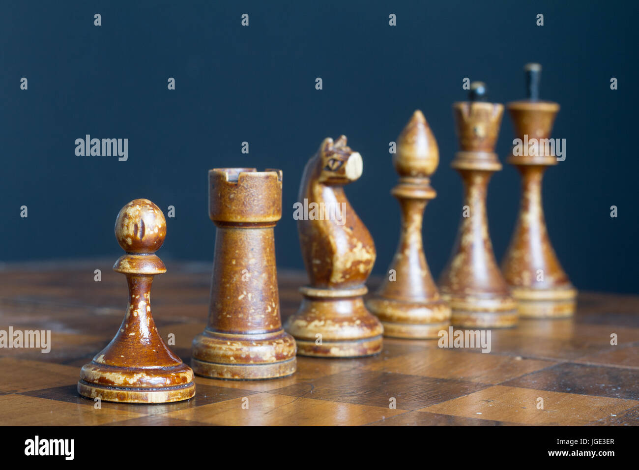 Ancient wooden chess pieces on an old chessboard Stock Photo - Alamy