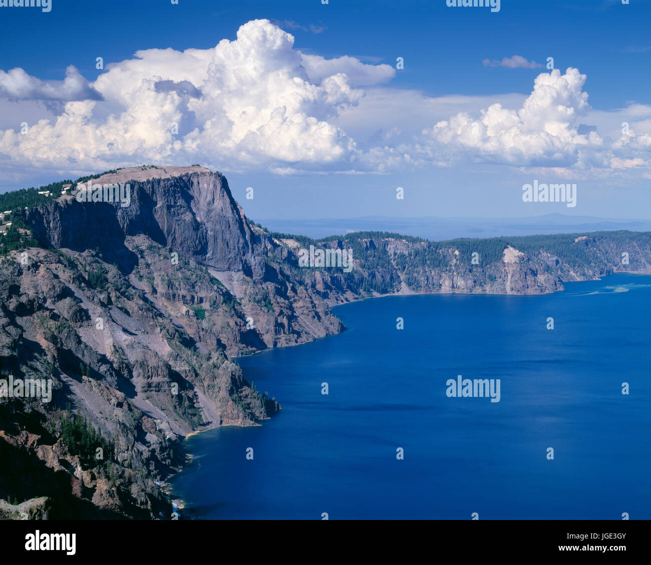 USA, Oregon, Crater Lake National Park, Thunder clouds float over Llao Rock (left) and north rim of Crater Lake. Stock Photo