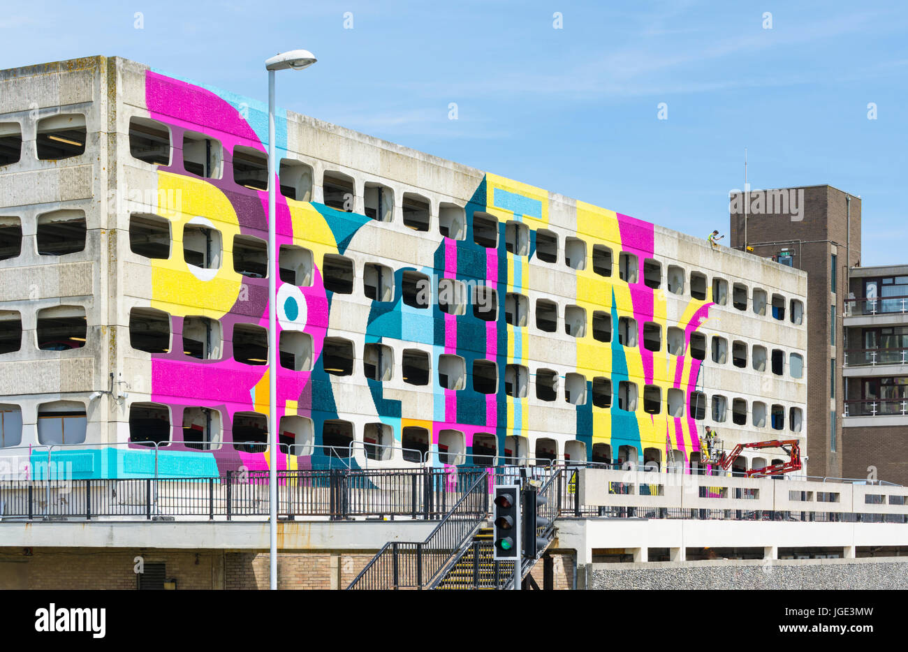 Grafton multi-storey car park being painted to become the UK's largest outdoor artwork. Grafton car park in Worthing, West Sussex, England, UK. Stock Photo