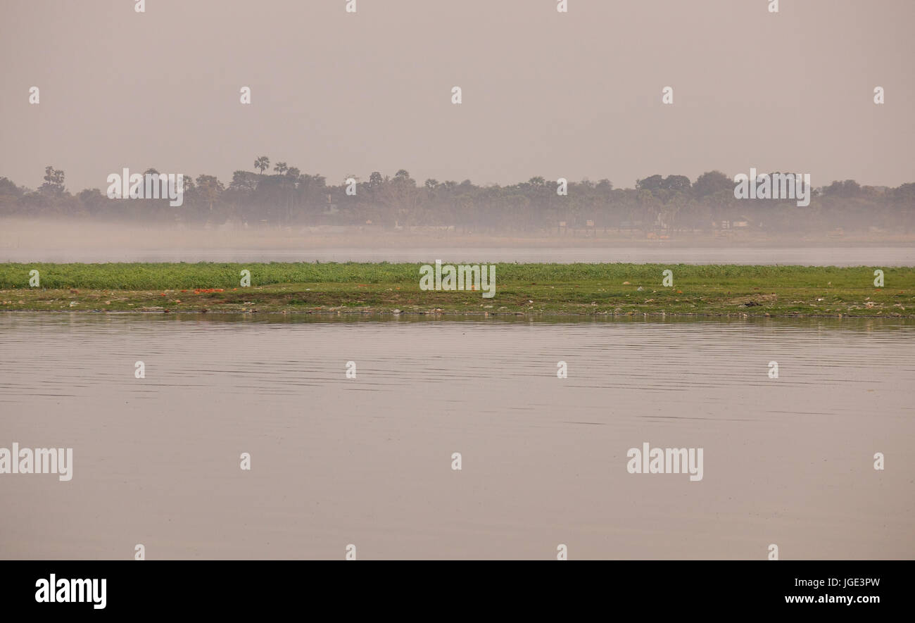 Lake scene in early morning in misty day Stock Photo - Alamy