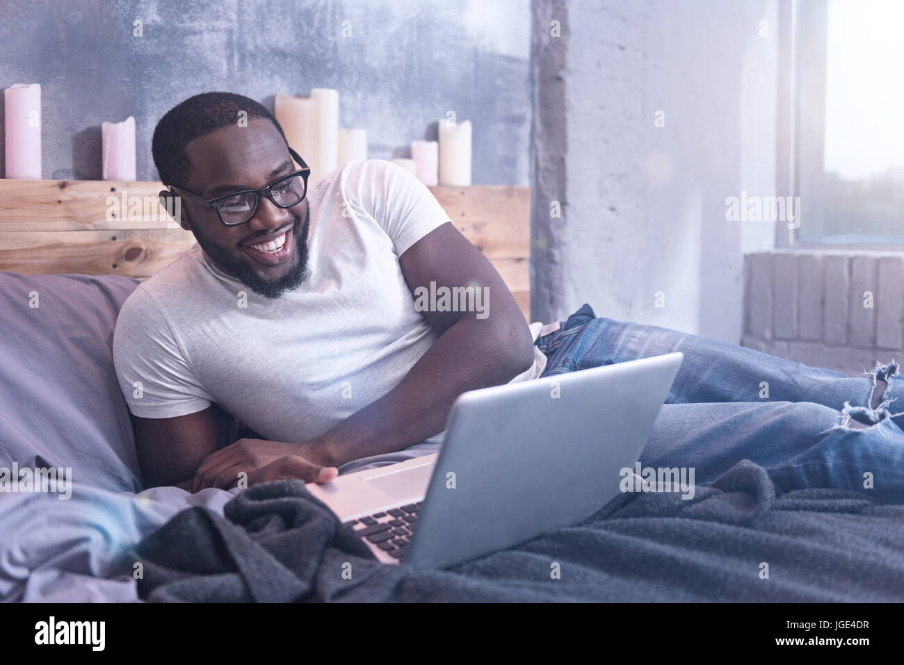 Charismatic African American man freelancing at home Stock Photo