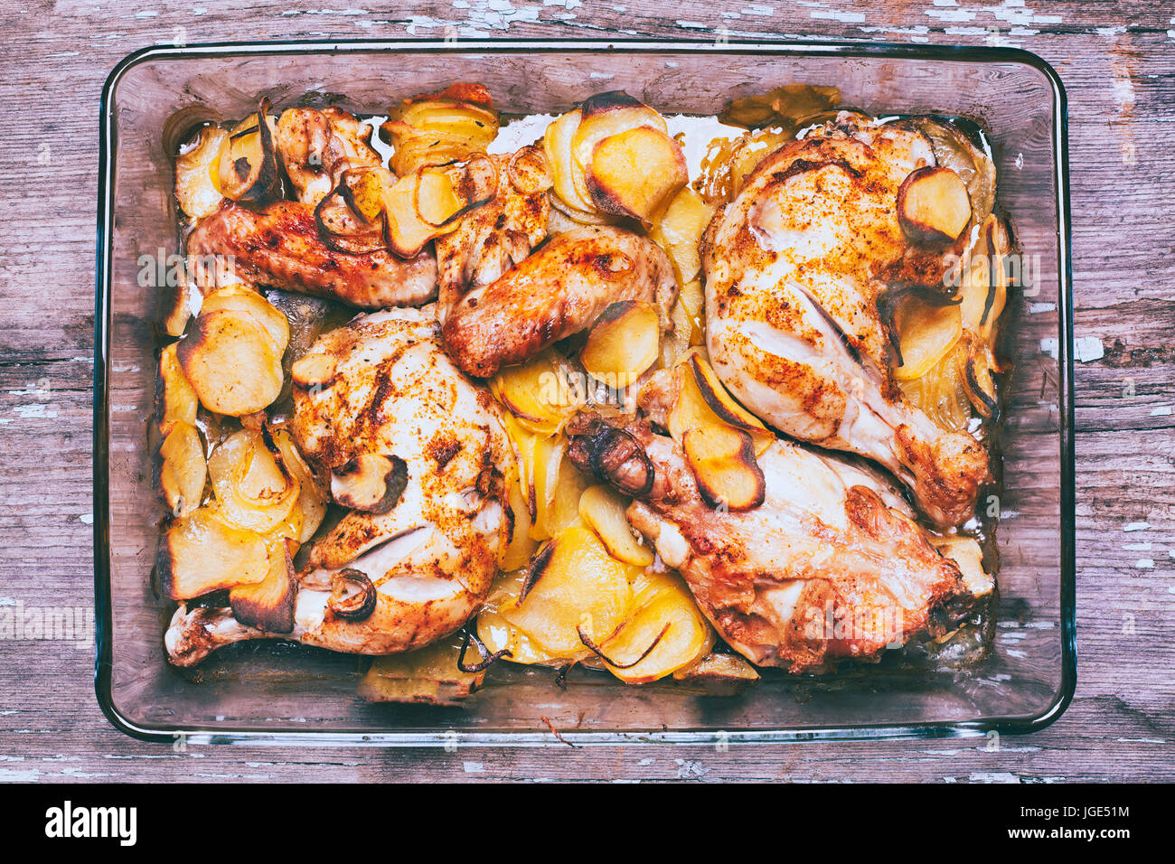 Potato and chicken casserole in baking dish Stock Photo