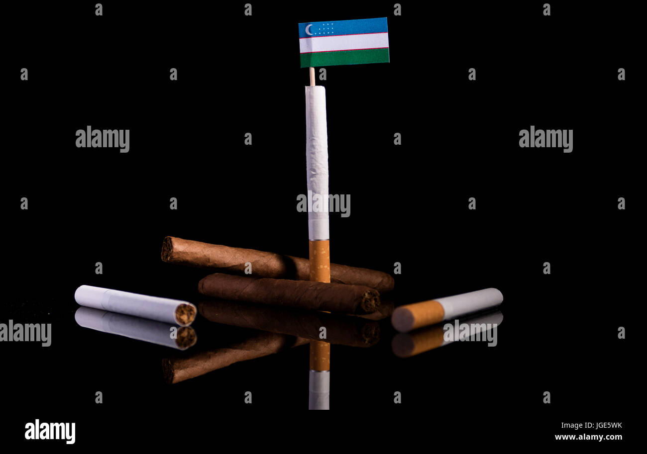 cigarettes in uzbekistan Uzbekistan flag with cigarettes and cigars. Tobacco Industry concept Stock  Photo