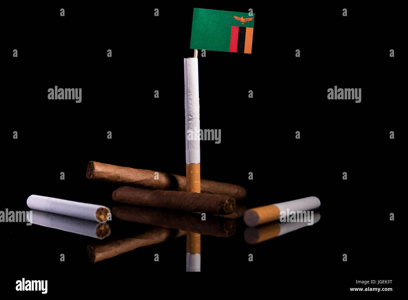 Zambia flag with cigarettes and cigars. Tobacco Industry concept Stock