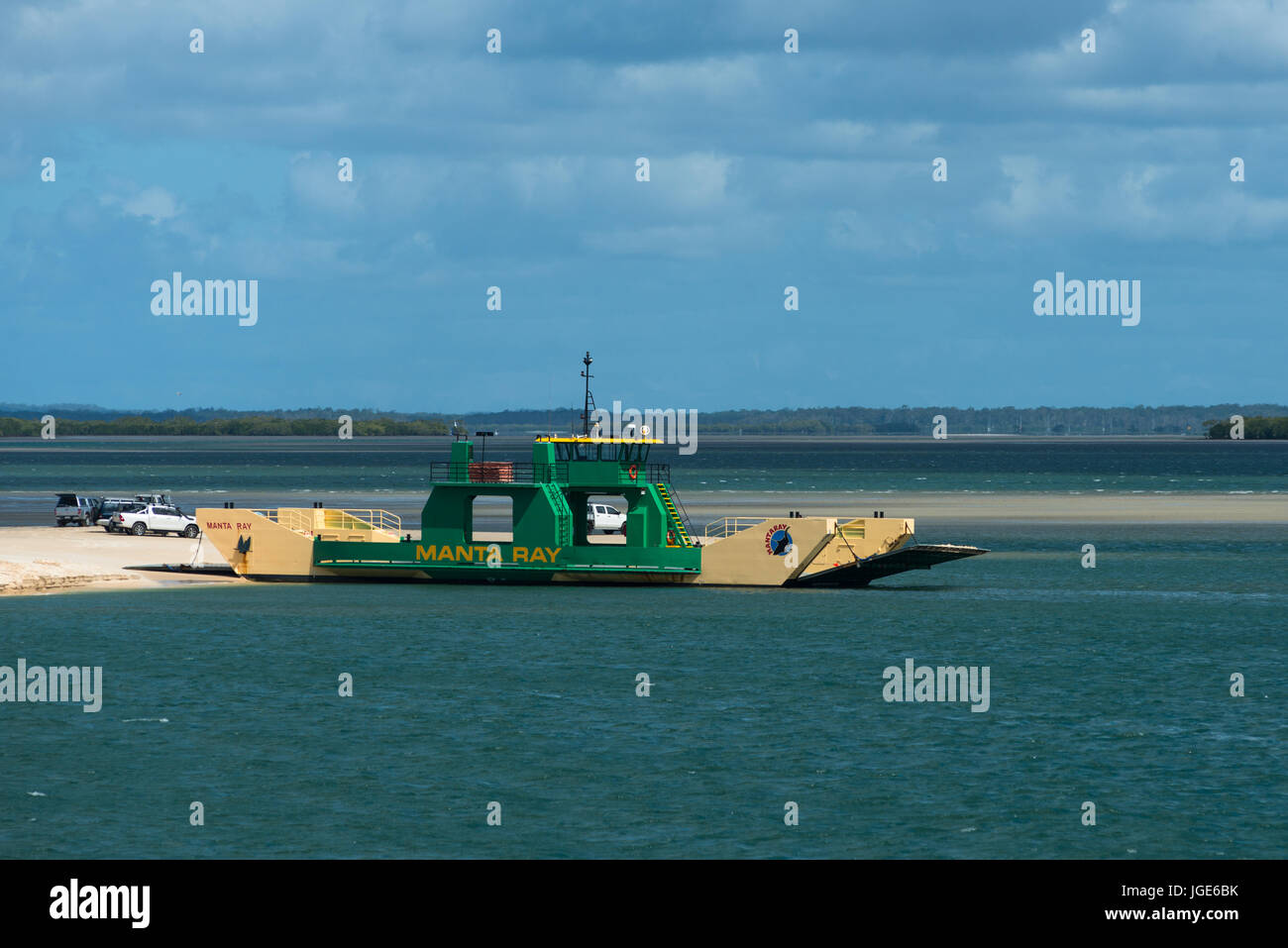 Ferry carrying vehicles across to Fraser Island from mainland Australia. Stock Photo