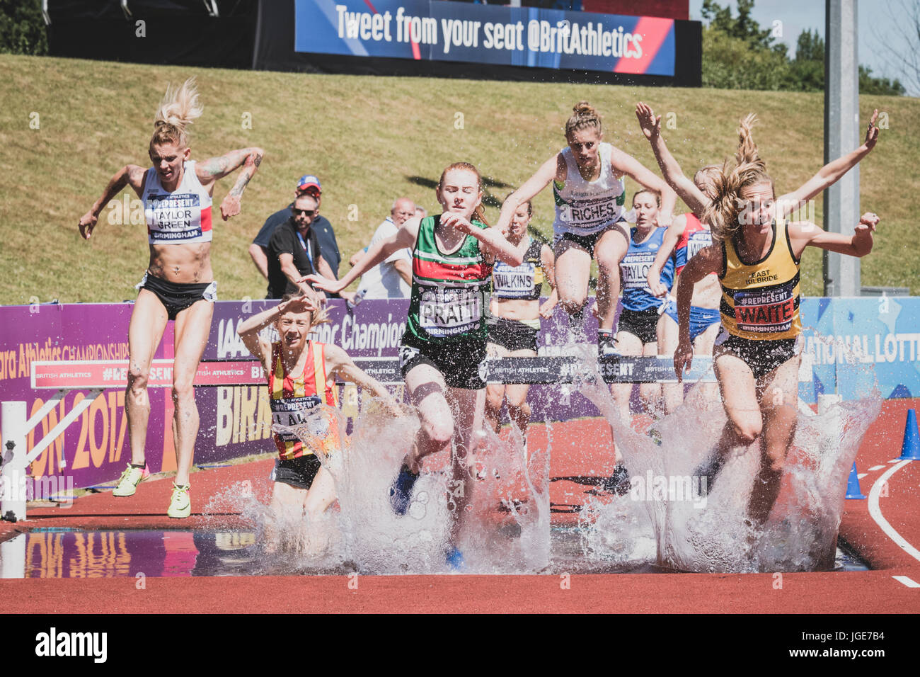 The women's steeplechase clears the water jump at the British Athletics Championships and World Trials at Birmingham, United Kingdom on 1-2 July 2017 Stock Photo