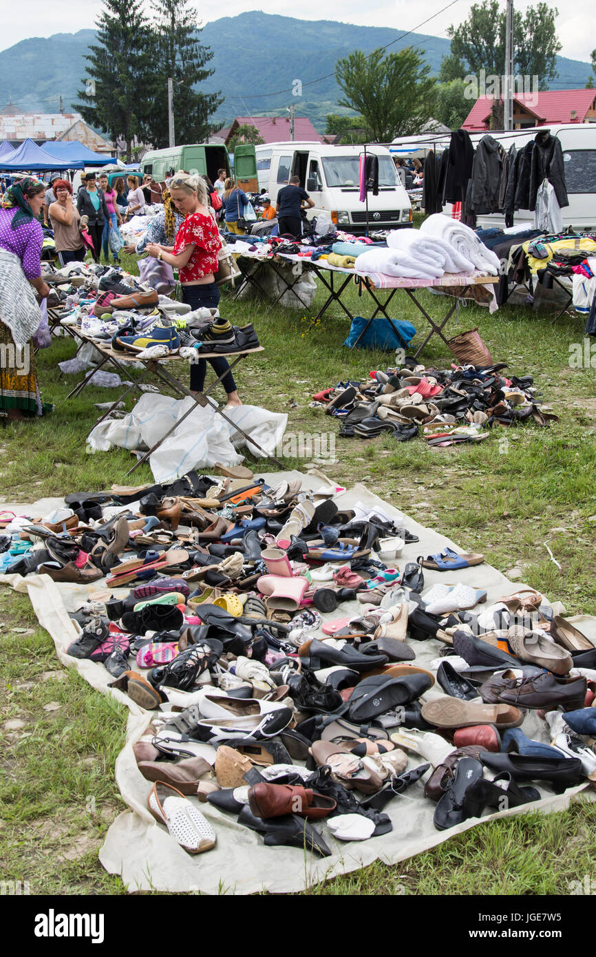 Sale of shoes used in an open market in the Maramures region, Romania Stock Photo