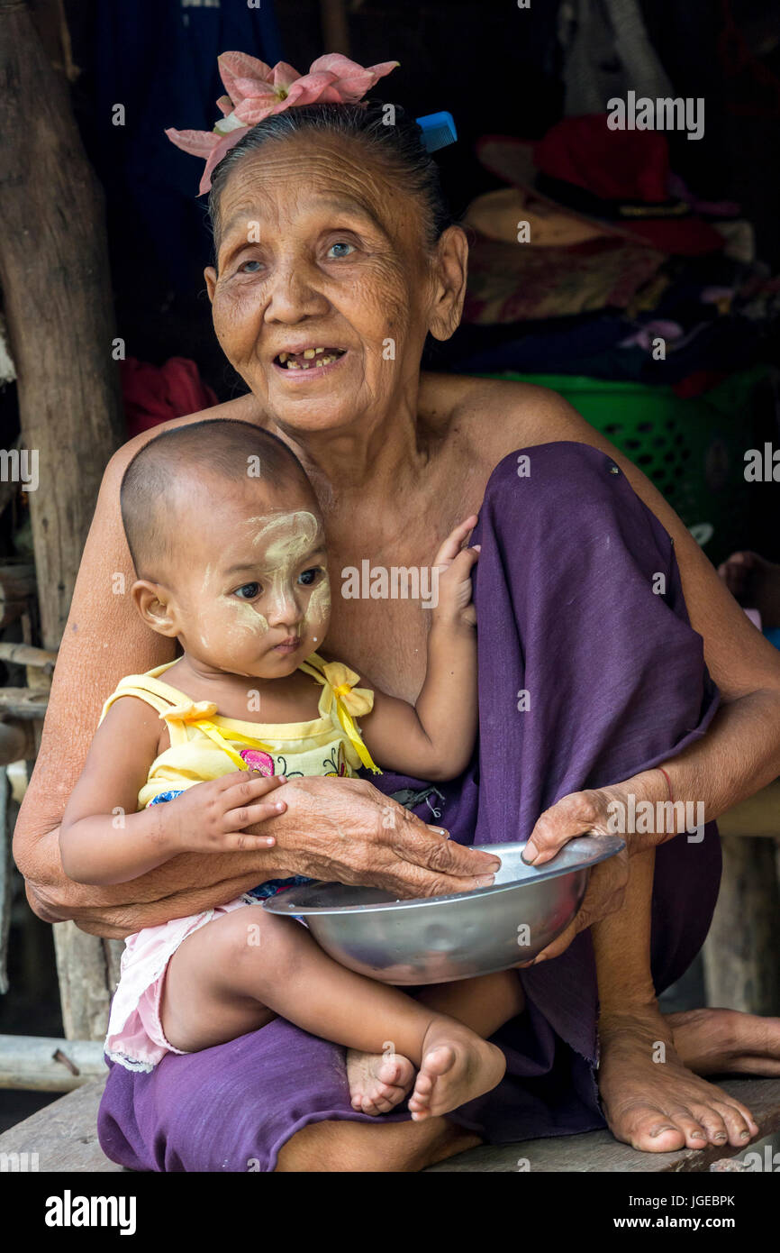 Old lady giving food to a baby Stock Photo - Alamy