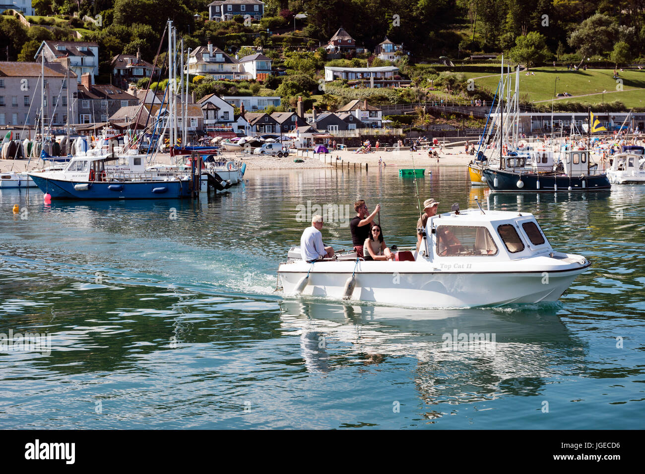 People on a boat at the harbour, Lyme Regis, Dorset, UK. Stock Photo