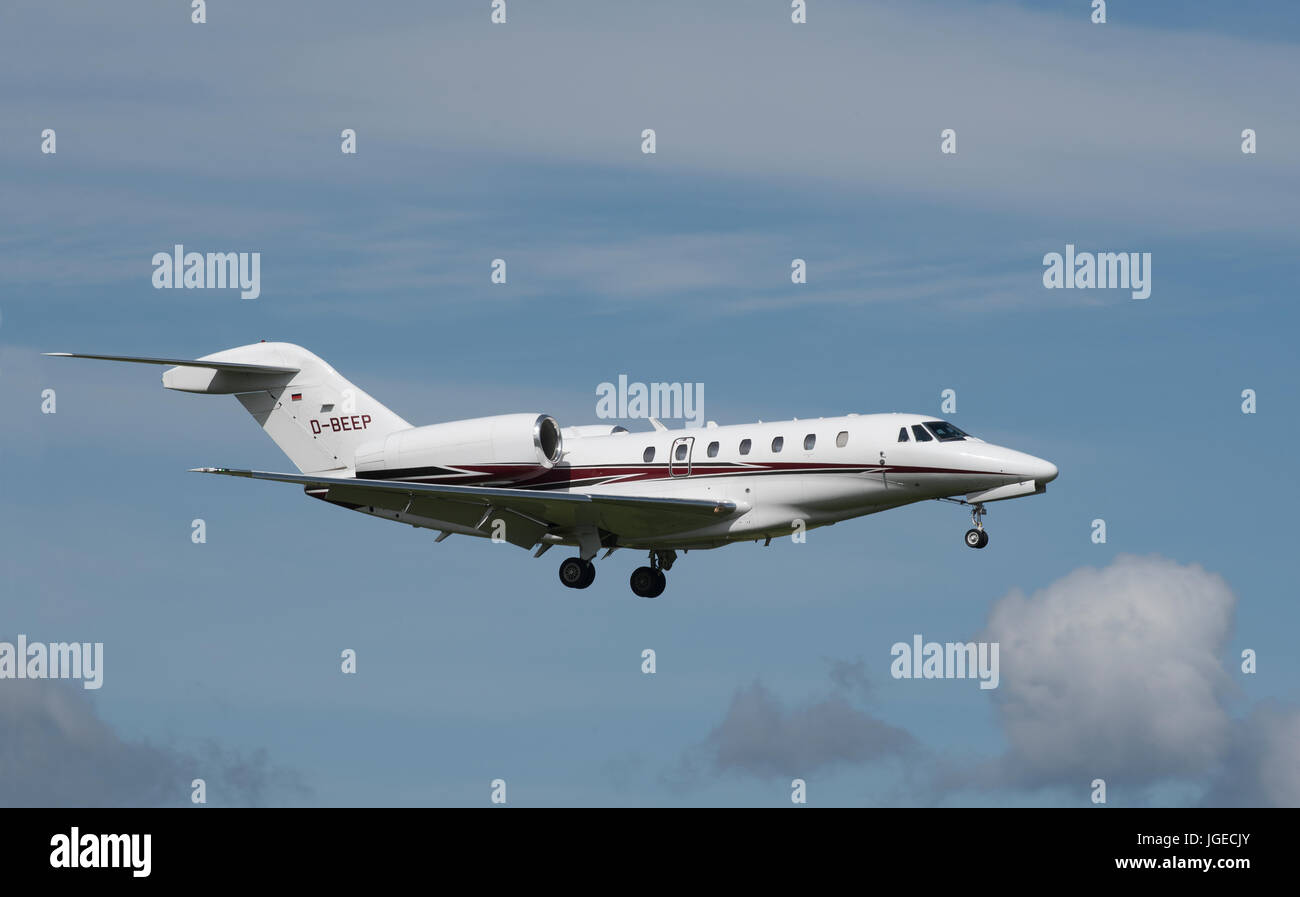 A German registered Cessna 750 Citation X on final approach to Inverness Airport in the Scottish Highlands North East Scotland. Stock Photo