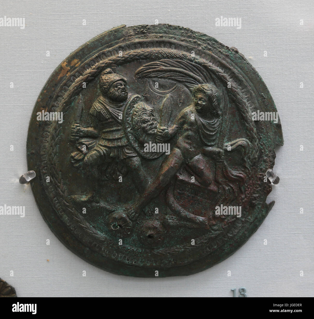 Bronze relief from a lidded-mirror. Young man and warrior.  Etruscan, 250-150 BC. Italy. British Museum. London. UK. Stock Photo