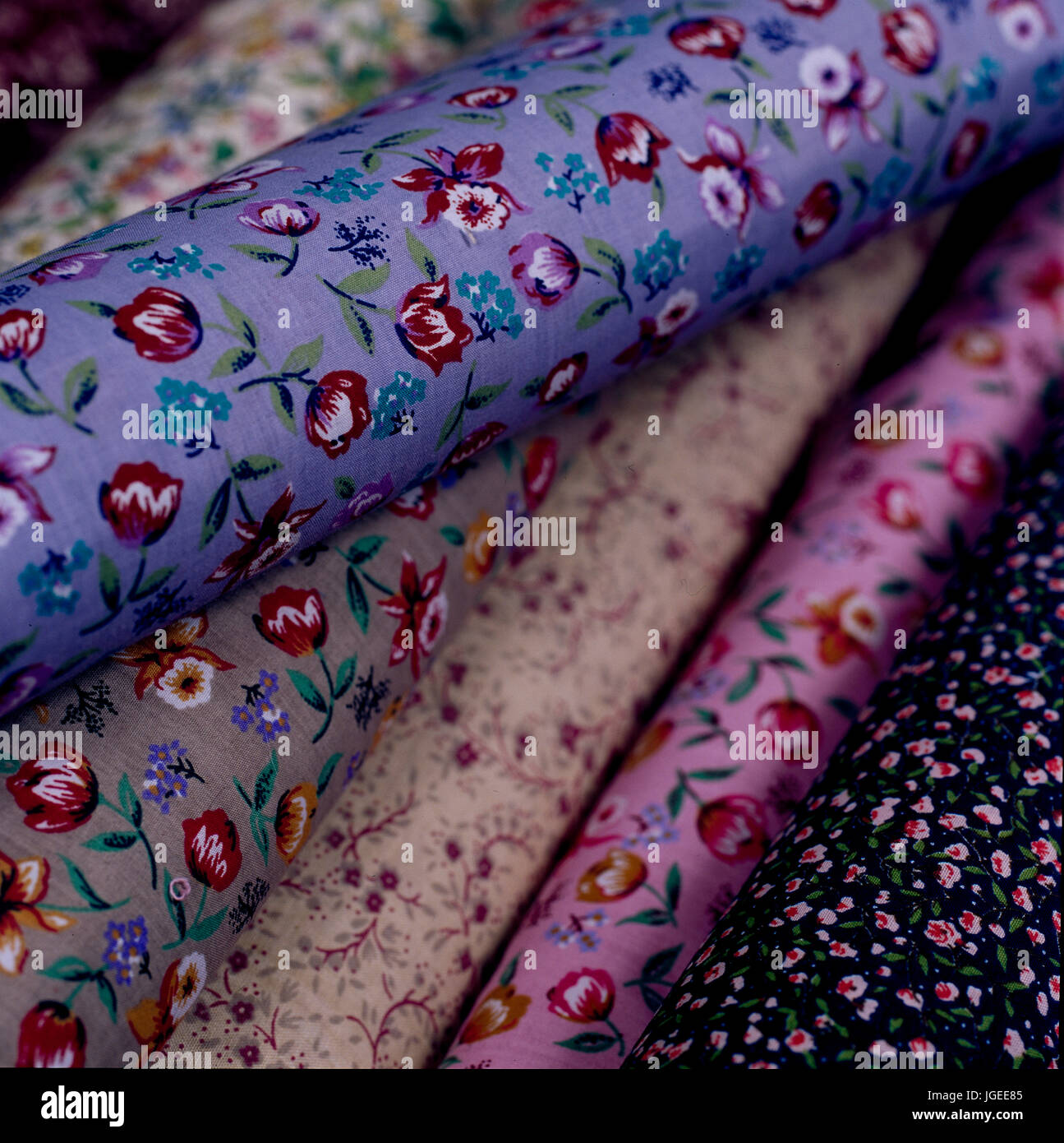 Assorted rolls of floral fabric. Step x step shots of craft and diy projects Stock Photo