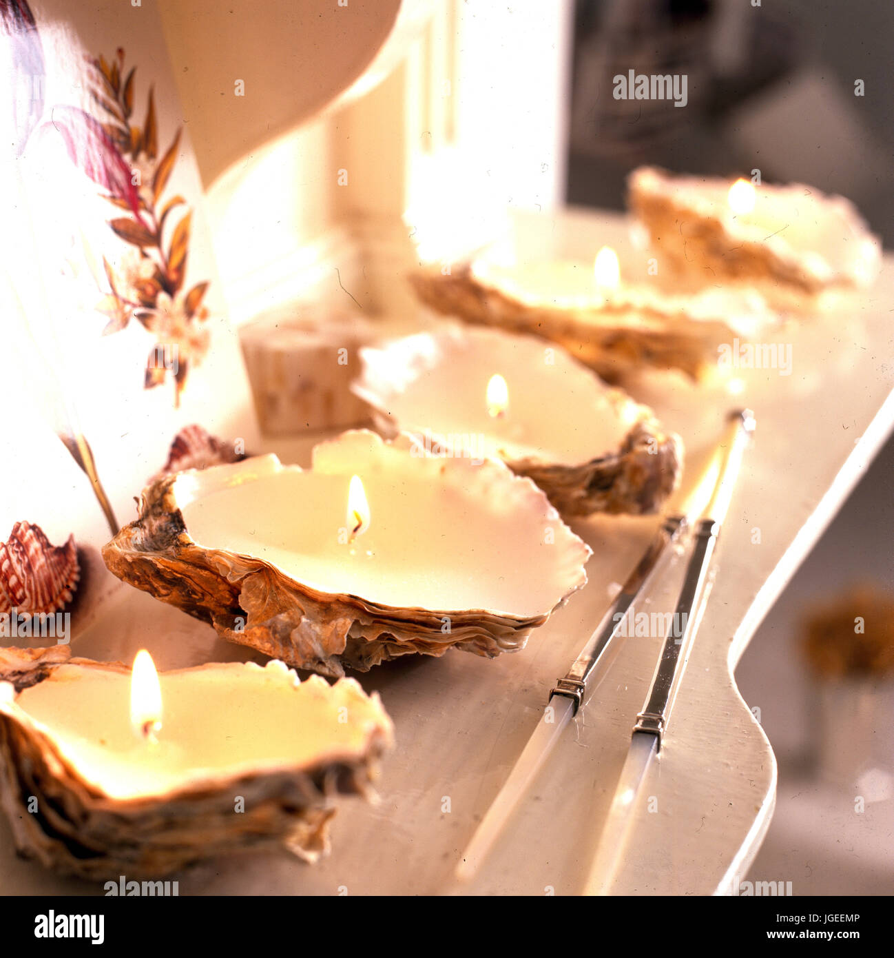Oyster shells used as candle holders Stock Photo - Alamy