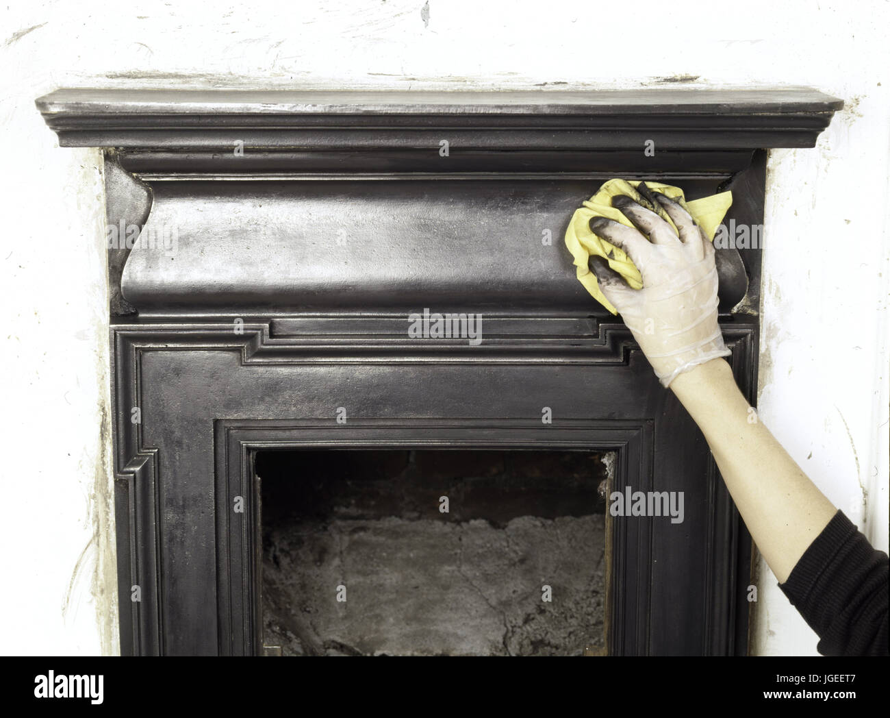 A Hand Polishing Up A Renovated Cast Iron Fireplace Renovating