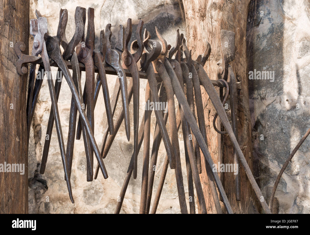 Blacksmith Tongs Tool Hanged In Forge Stock Photo - Download Image