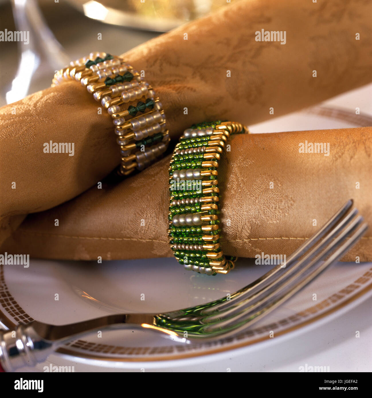Beaded bracelets used as serviette or napkin rights Stock Photo