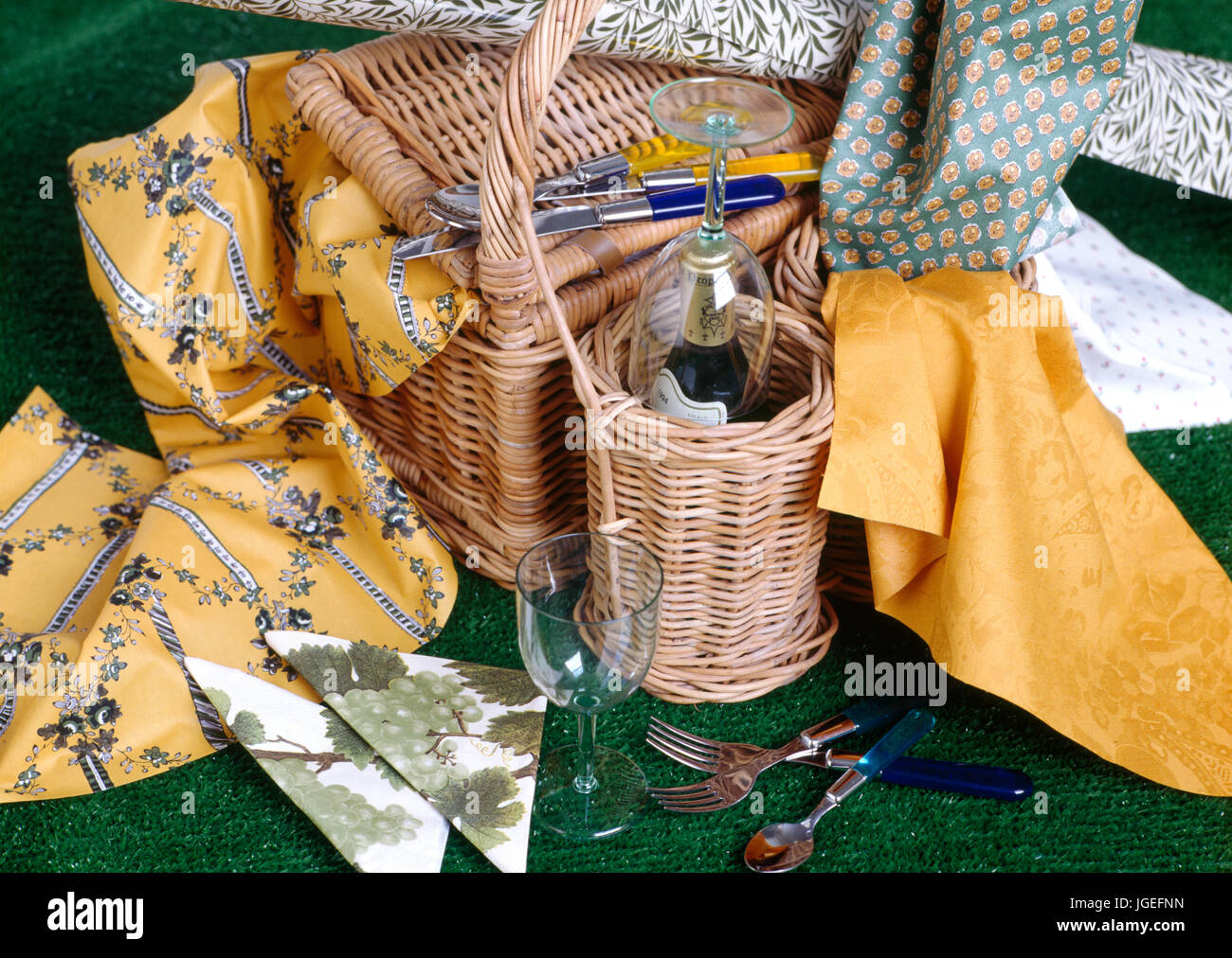 Picnic basket with wine bottle and glasses Stock Photo