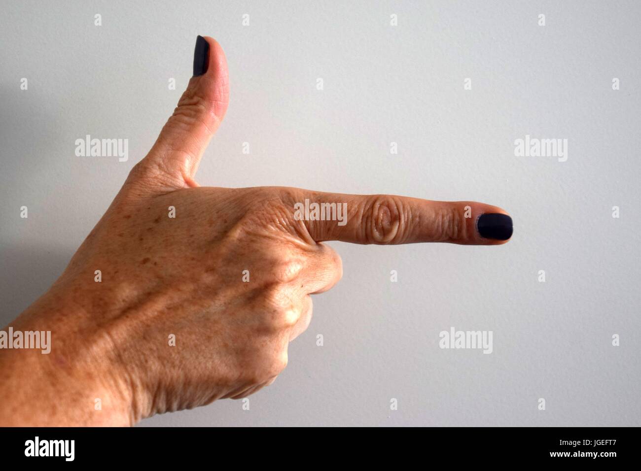 fingers make signs, Handzeichen, glasses in the Hand, Brille in der Hand Stock Photo