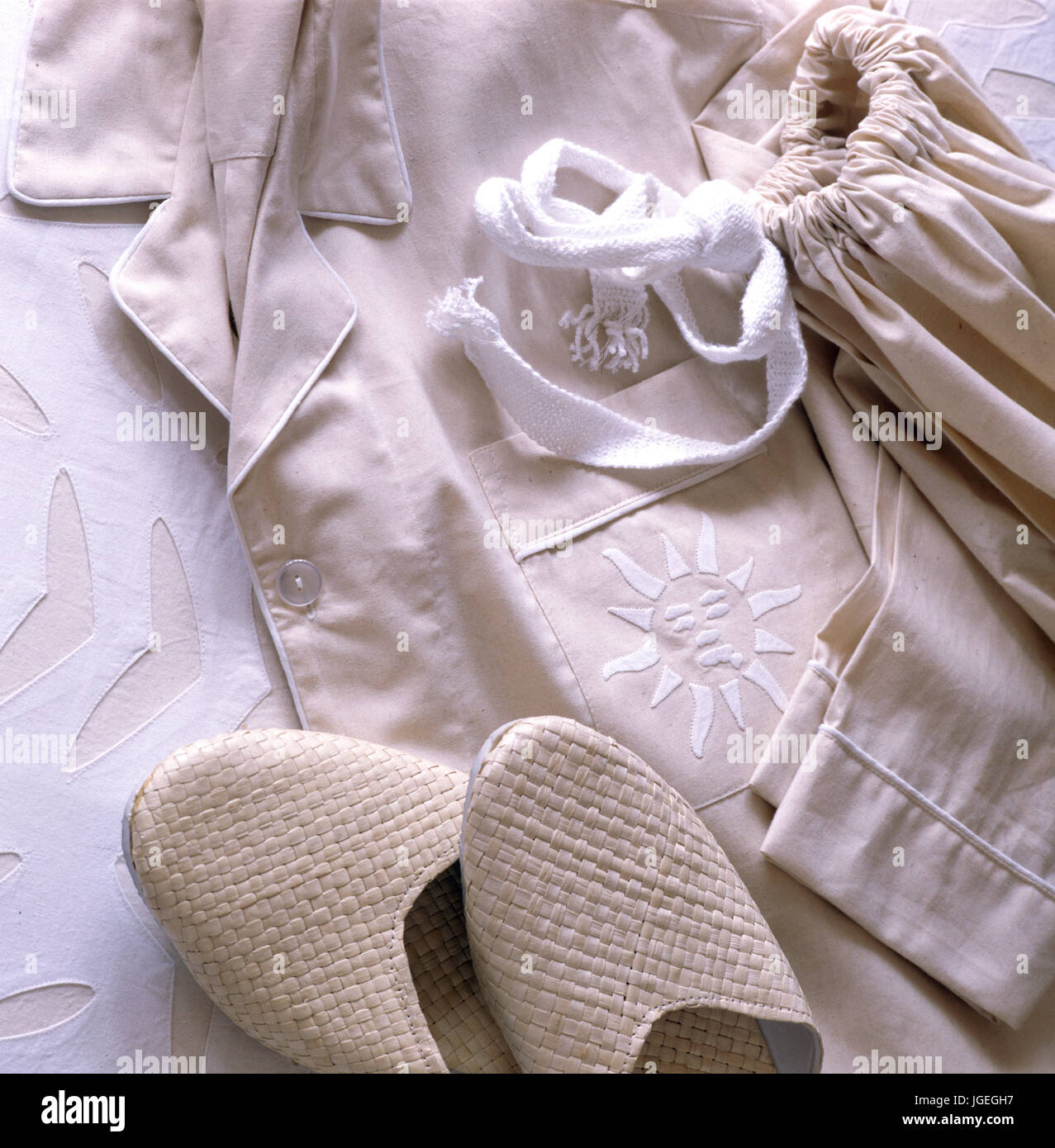 Closeup of cream cotton pyjamas  and slippers Stock Photo