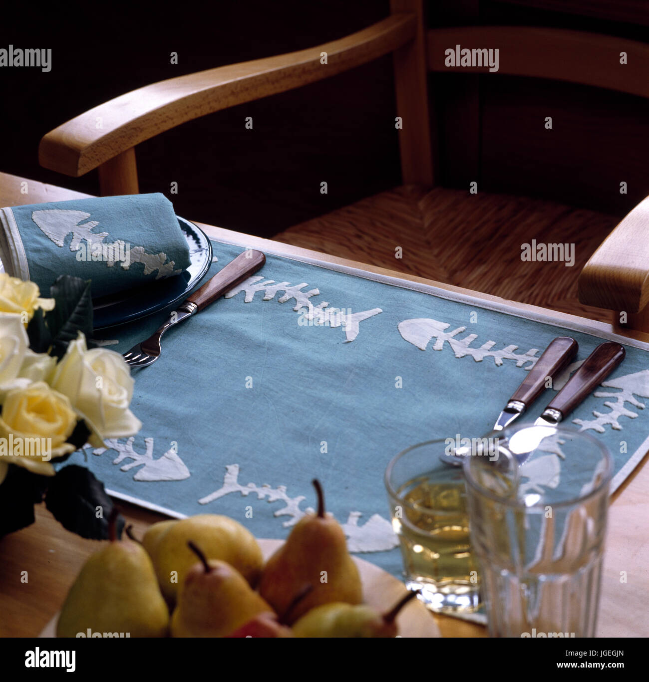 Closeup of embroidered and appliqued linen place mat. Stock Photo
