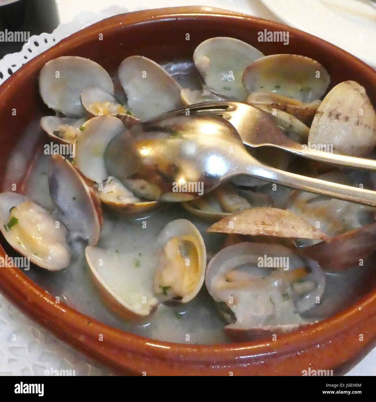 Typical dish of the Basque Country, clams in green sauce Stock Photo