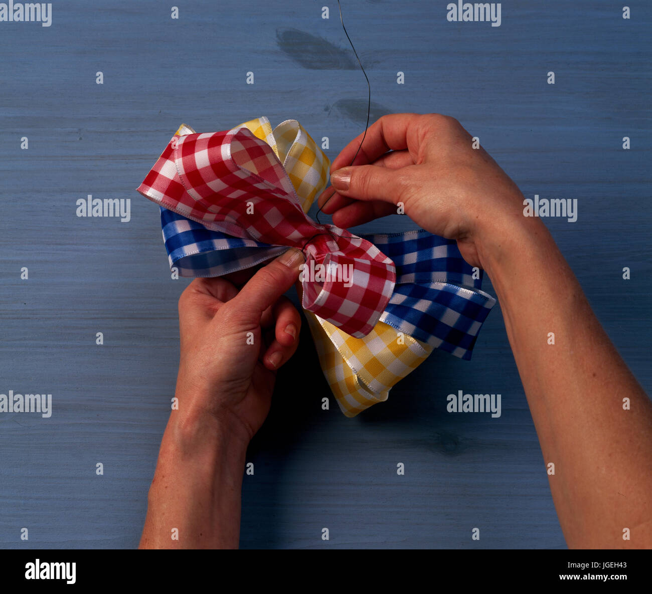 Tying ribbons. Step x step shots of craft and diy projects Stock Photo