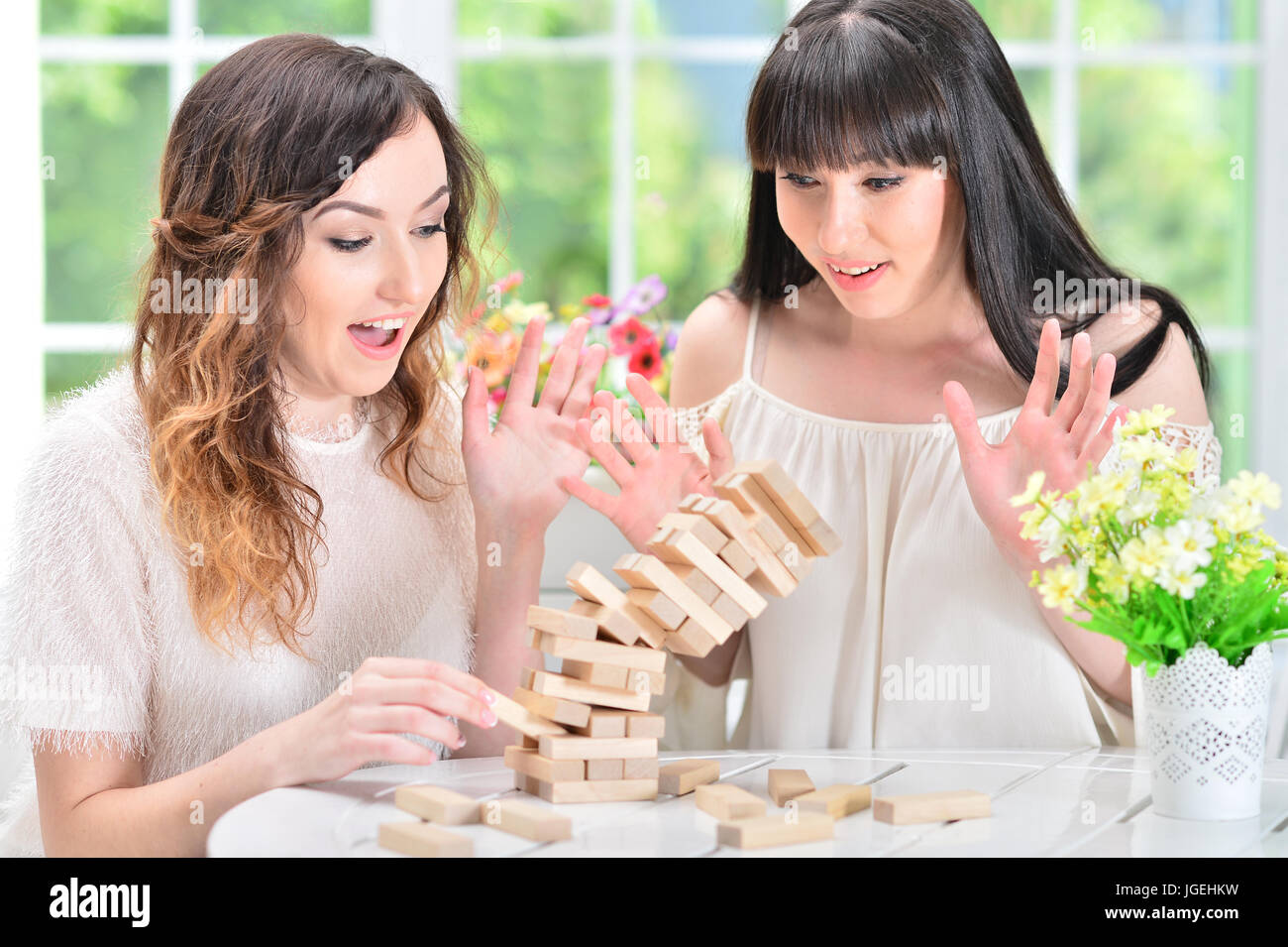 Female Blocks Girls playing colorful blocks hi-res stock photography and images - Alamy