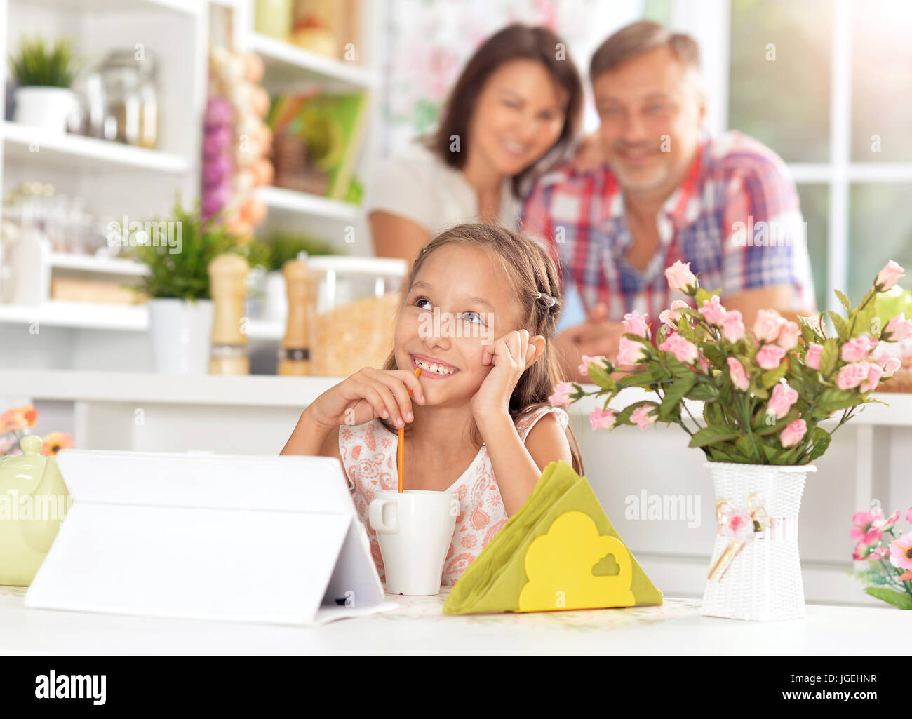 Beautiful little girl with tablet pc Stock Photo - Alamy