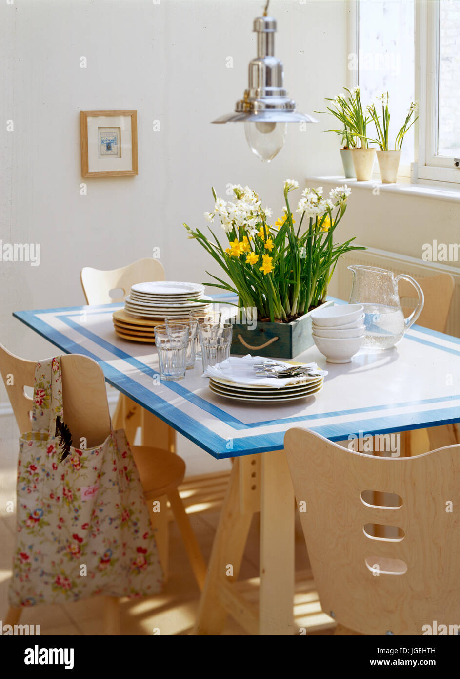 Glass topped trestle table with spring flowers Stock Photo Alamy
