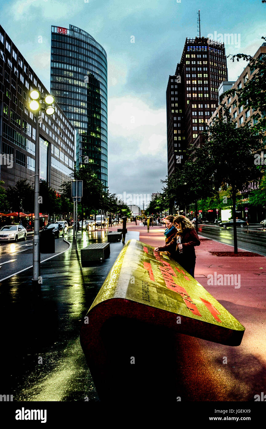 BERLIN GERMANY - WOMEN LOOKING TO A STONE MAP - POSTDAMER STRABE - BERLIN STREET - POSTDAMER PLATZ AREA - AUTUMN IN BERLIN © Frédéric BEAUMONT Stock Photo