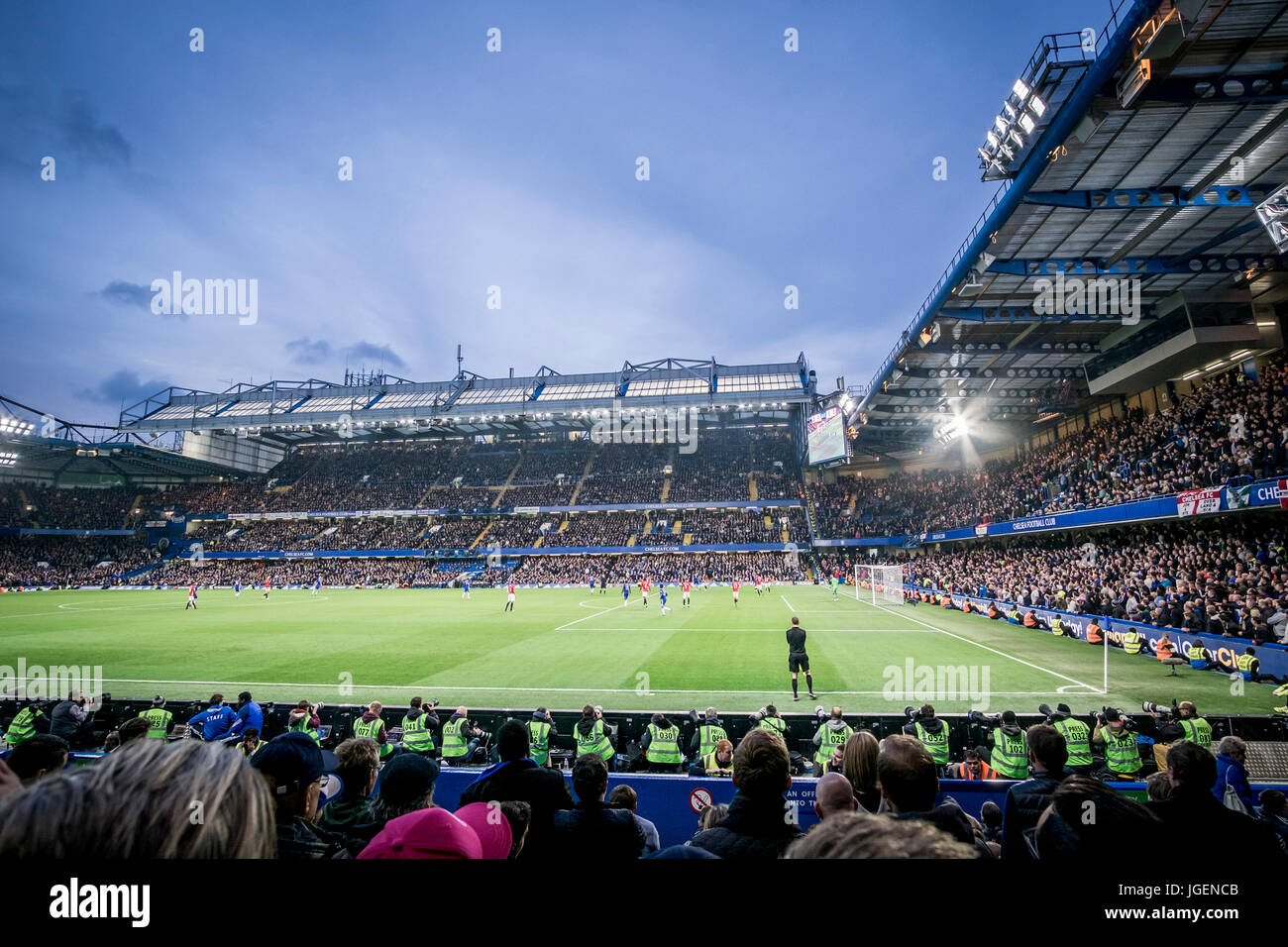 People watching a match at the Stamford Bridge football stadium, which is  located in Fulham in London, United Kingdom. The Stadium is home ground of Chelsea  F.C. and has a capacity of