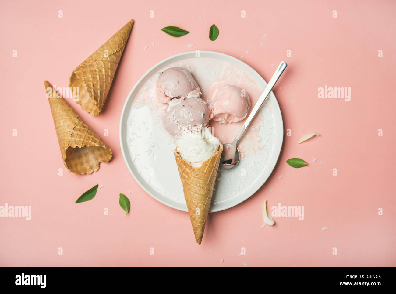 Flatlay of pastel pink strawberry and coconut ice cream scoops Stock