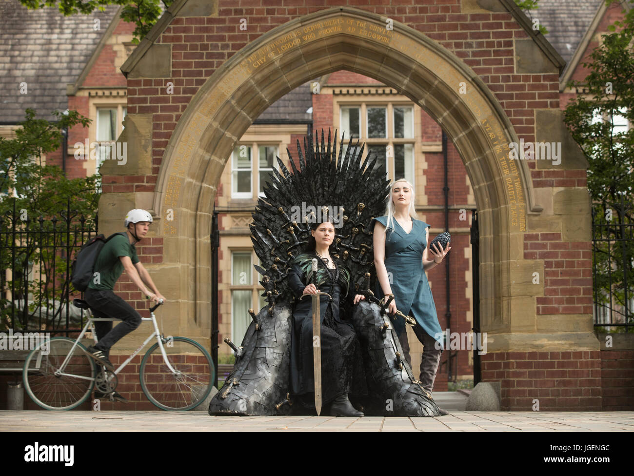 Susan Broadbent (left) dressed as Sansa Stark and Georgina Lambert dressed as Daenerys Targaryen with a replica of the throne made famous by TV's Game of Thrones during the International Medieval Congress at Leeds University. Stock Photo