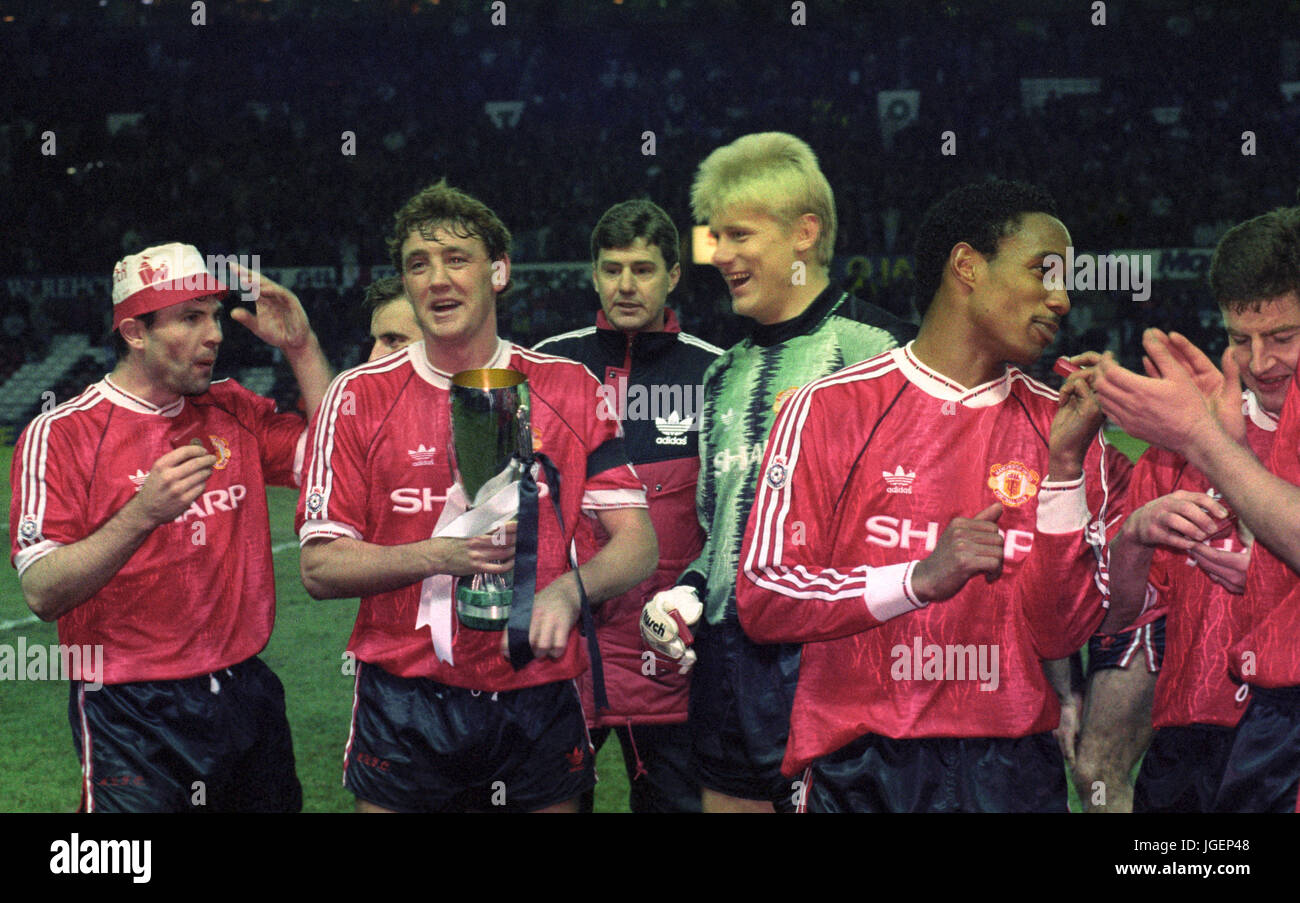 Manchester United captain Steve Bruce celebrates with team-mates after winning the European Super Cup at Old Trafford after they defeated Red Star Belgrade 1-0. Stock Photo