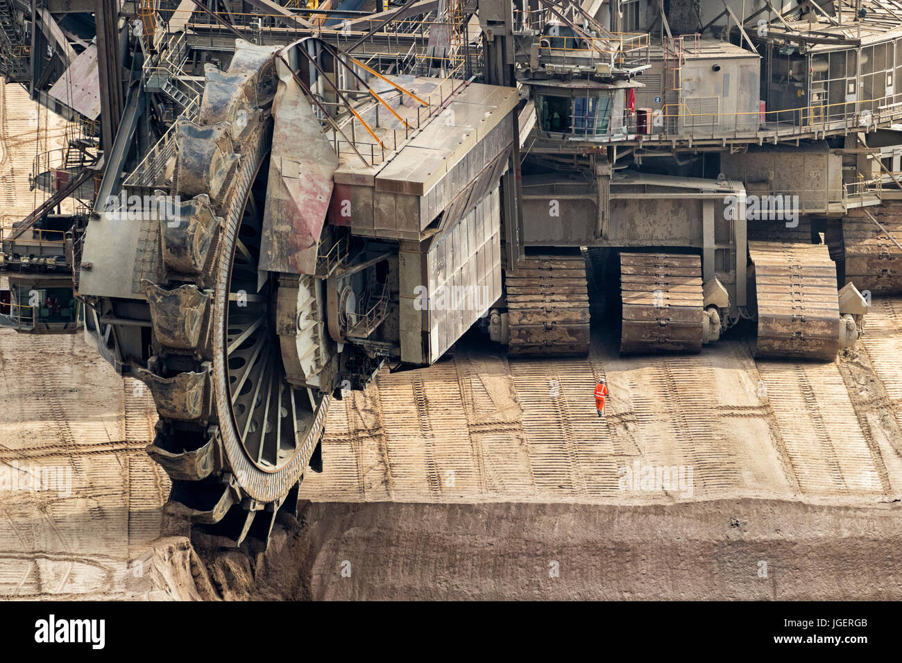 Bucket-wheel excavator mining in a brown coal open pit mine. Stock Photo