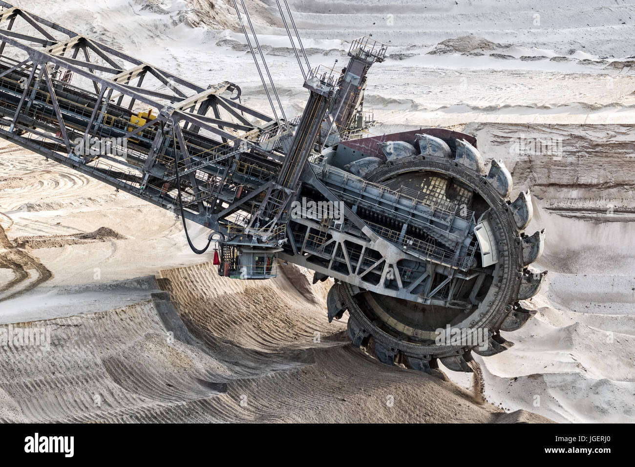 Bucket-wheel excavator mining in a brown coal open pit mine. Stock Photo